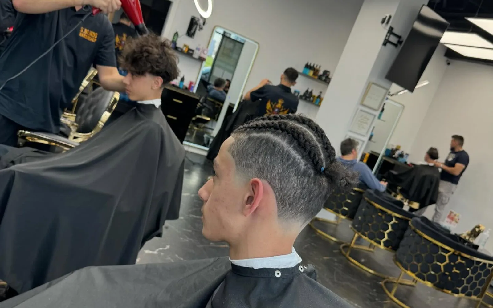 Interior of S Blends Barbershop with chairs and mirrors